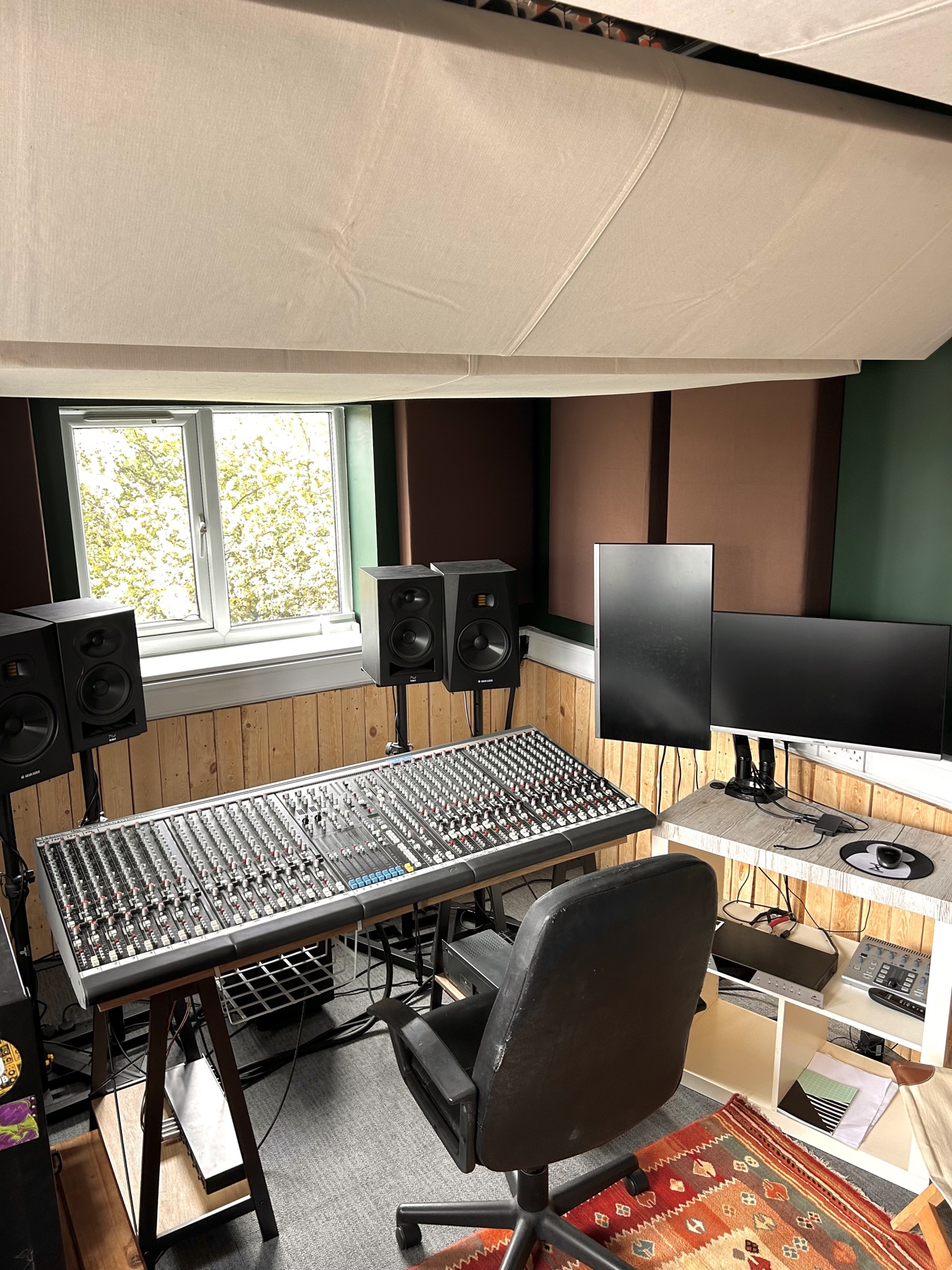Mixing desk and monitors in the Pirate Studios control room