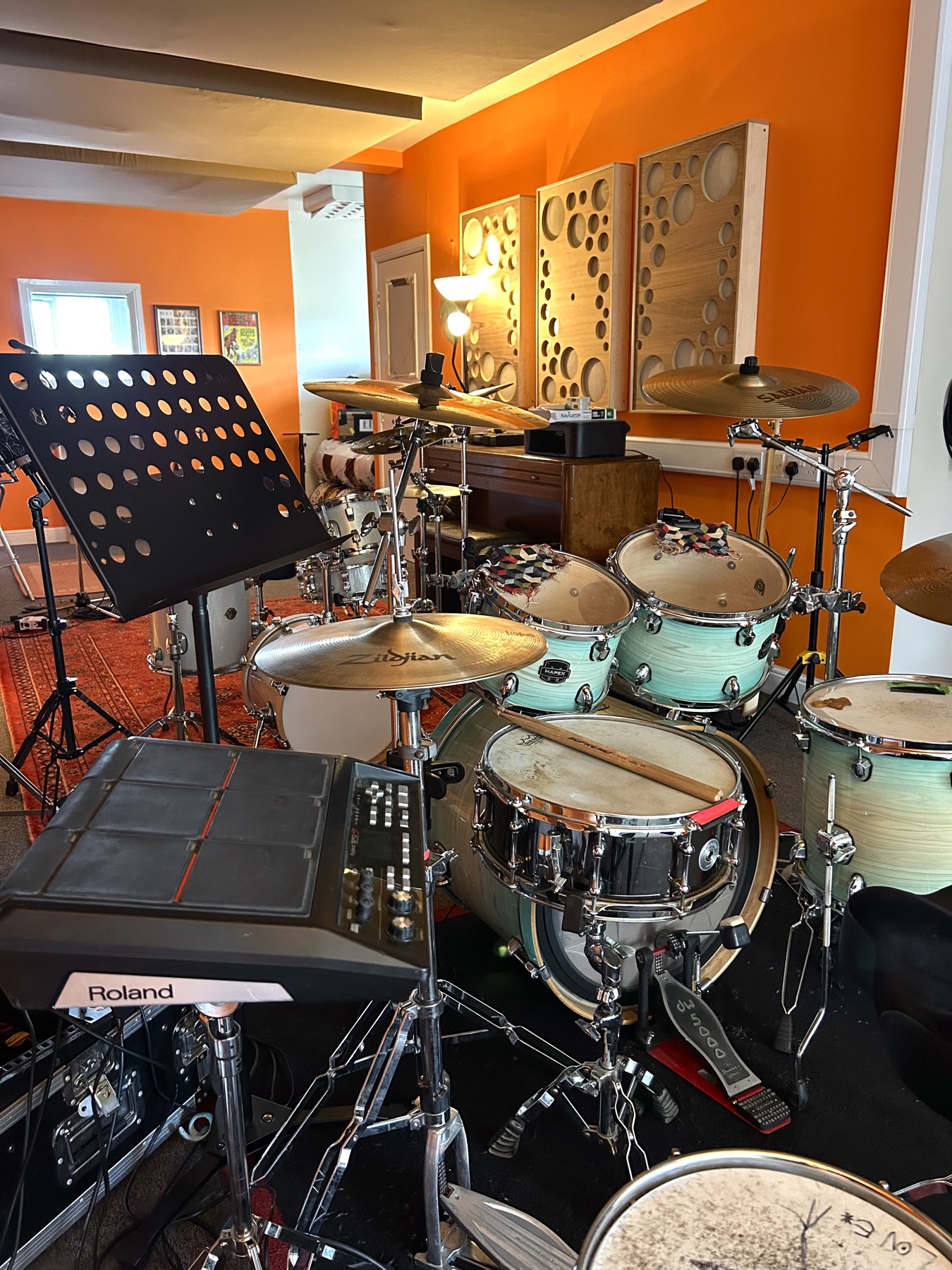 Close view of the drum kit and acoustic panels inside the studio